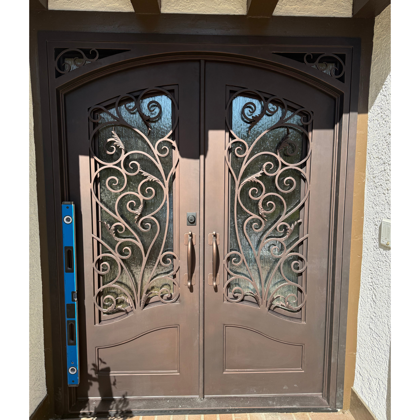 Black door with glass panel in a warehouse setting