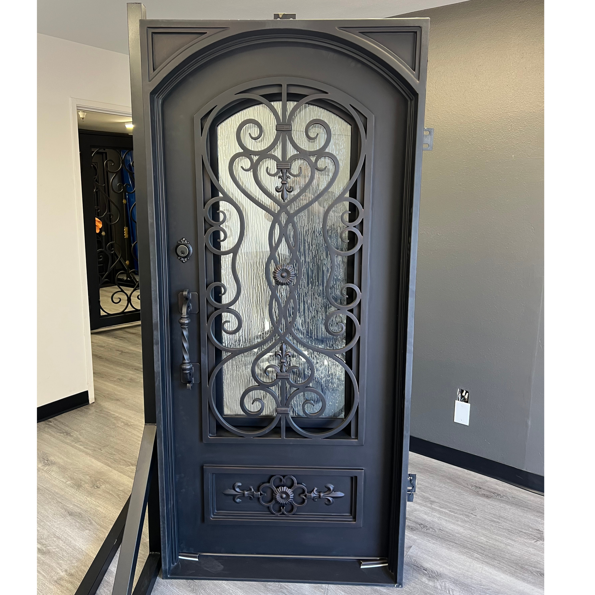 Decorative iron door with intricate designs in a home setting