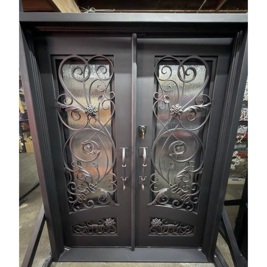 Decorative metal double door with intricate designs on a stand.