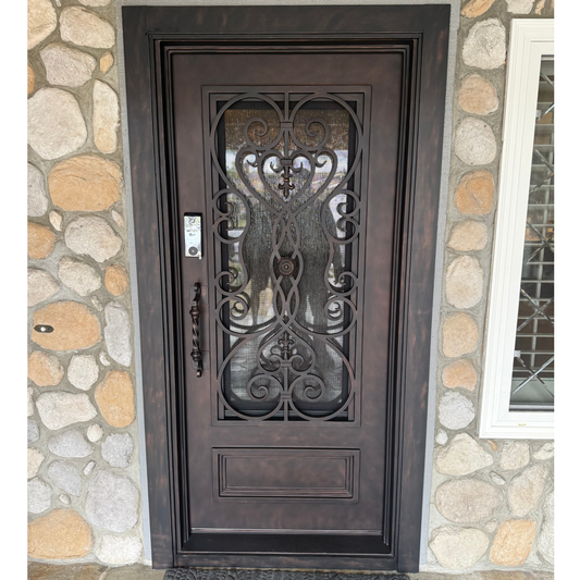 Decorative metal door with intricate designs in a warehouse setting