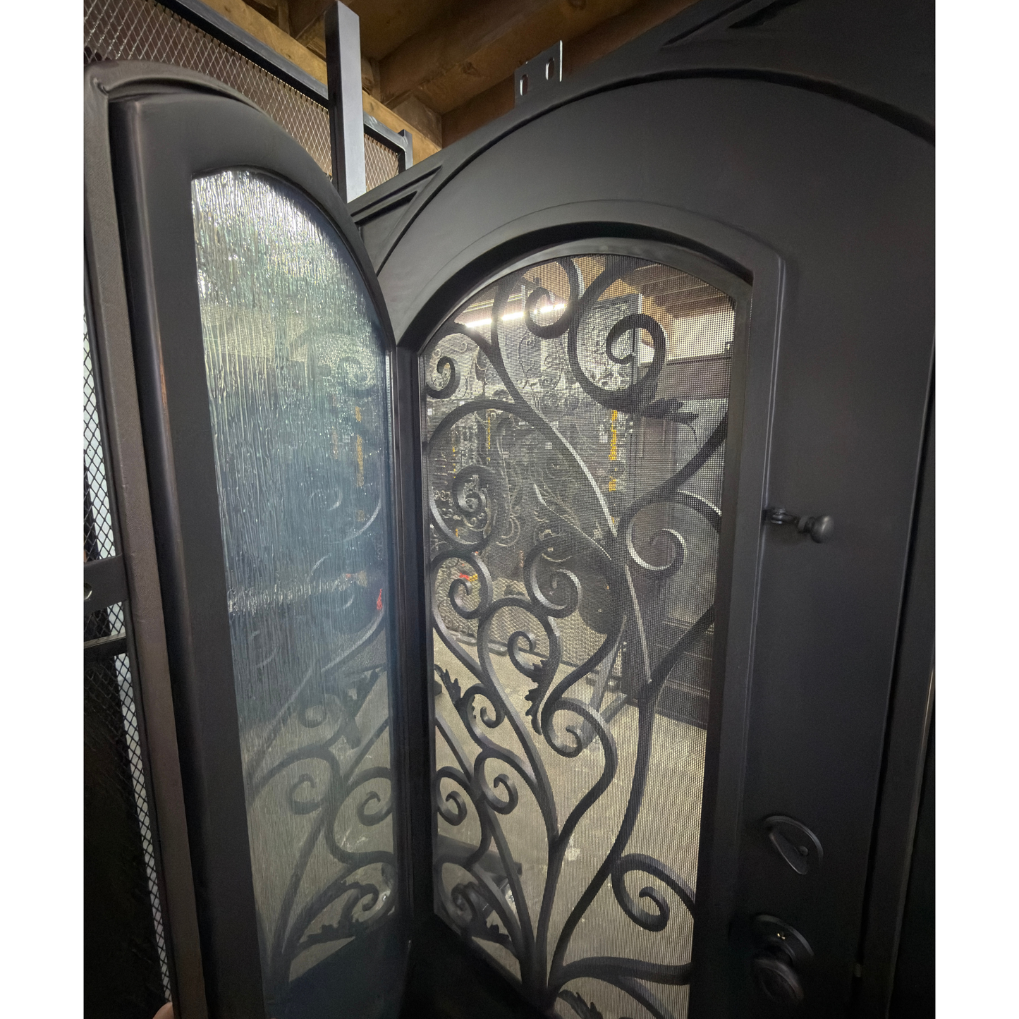 Decorative glass door with intricate metalwork in a home setting